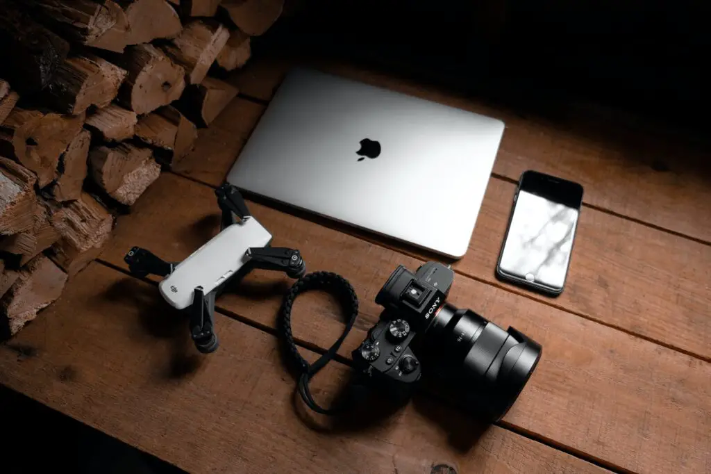 photo of gadgets on wooden table