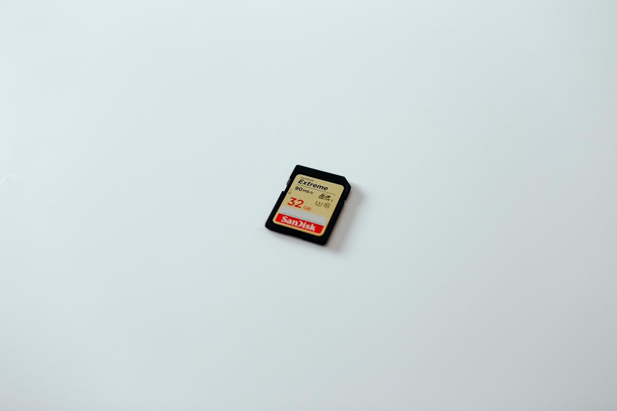 A compact SD card with the label '2GB SanDisk SD Card', representing its compact size and high storage capacity.