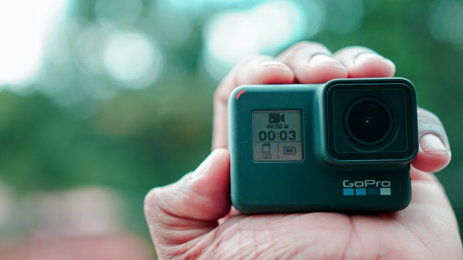 A GoPro device with buttons for navigation and a status screen, ready to capture adventure and stunning footage