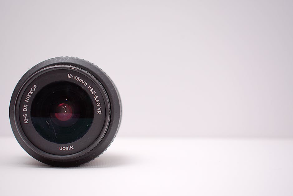A photo of a camera lens with an emphasis on a large aperture ring for sports photography