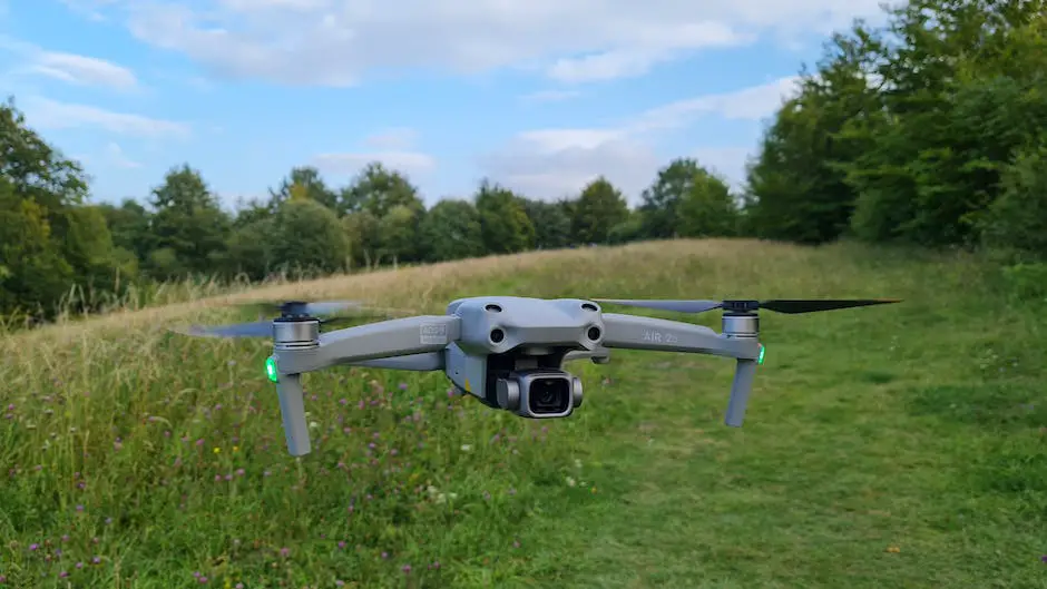 A drone flying over a field with blue sky in the background.