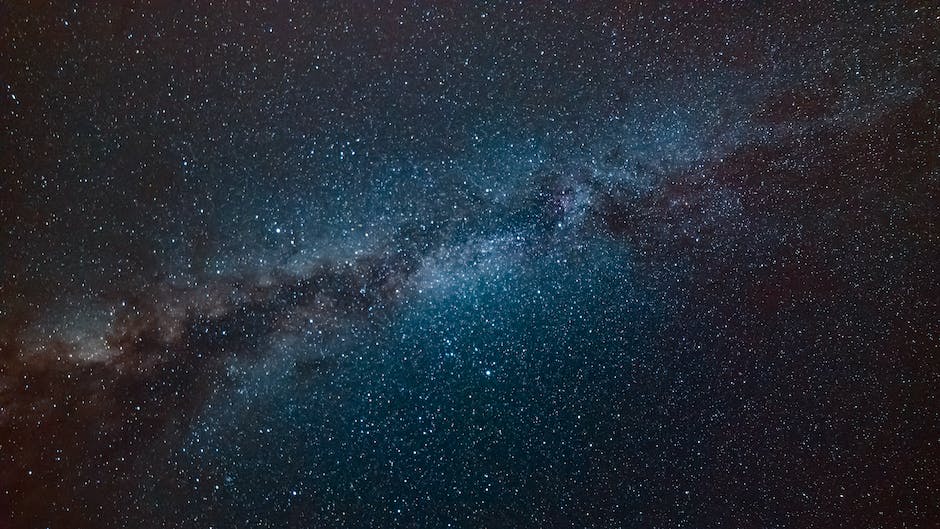 This is an image of the Milky Way galaxy, as captured by a camera in a dark location under clear skies. The image is made up of multiple stacked images and processed using Adobe Lightroom and Photoshop to bring out the details and colors of the galaxy.