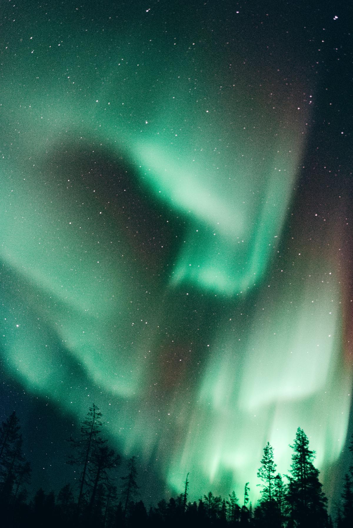 The northern lights is a natural phenomenon that occurs in the skies near the Arctic Circle, featuring colorful, dancing lights that illuminate the darkness.