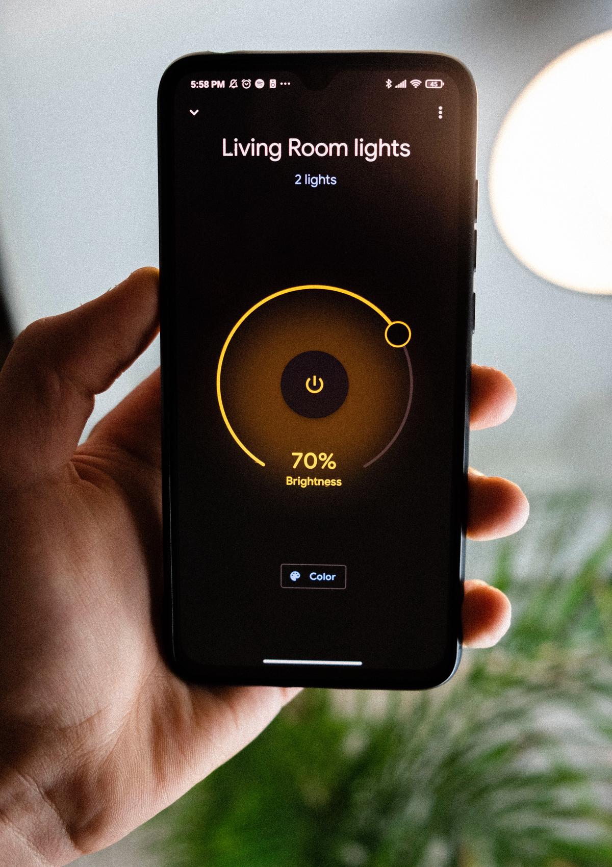 Image of a person controlling their smart home from their smartphone