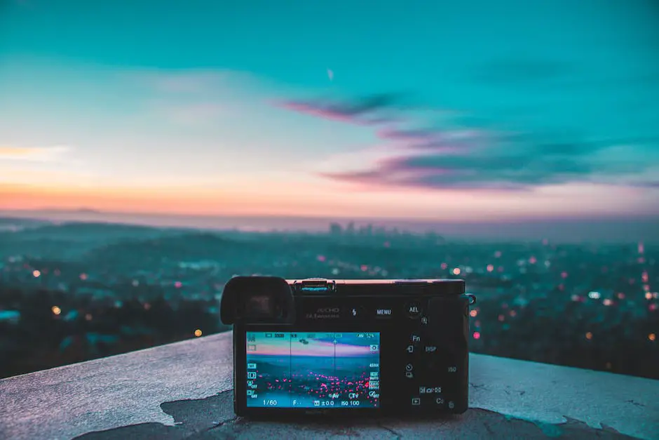 A person holding a camera and taking a photo of a beautiful landscape.