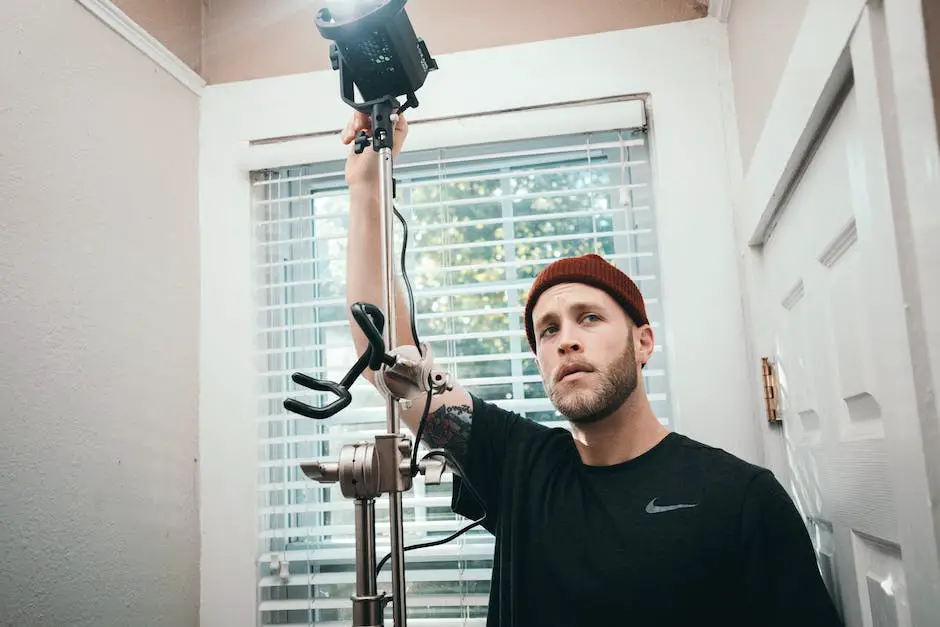 An image of a person holding a camera, microphone, and lighting equipment, representing vlogging gear on a budget.